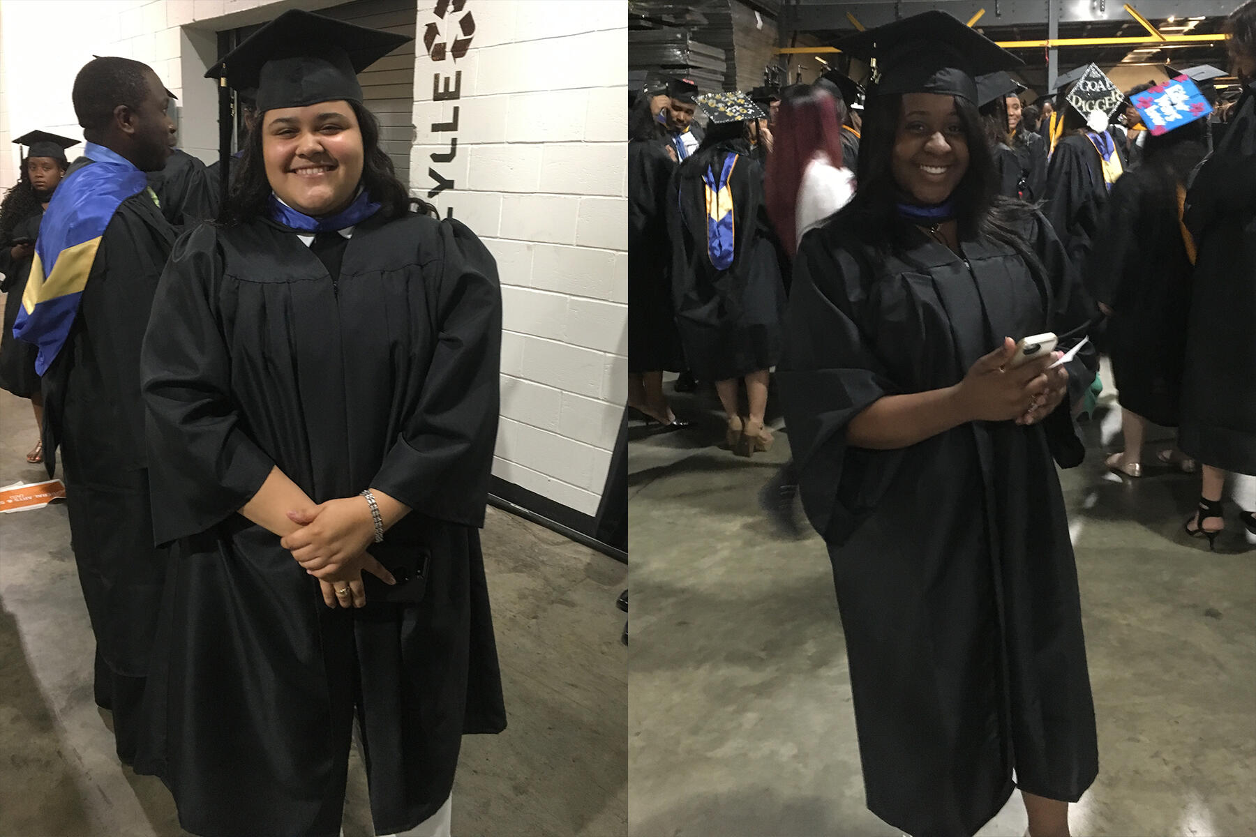 Two students backstage at graduation in full regalia.